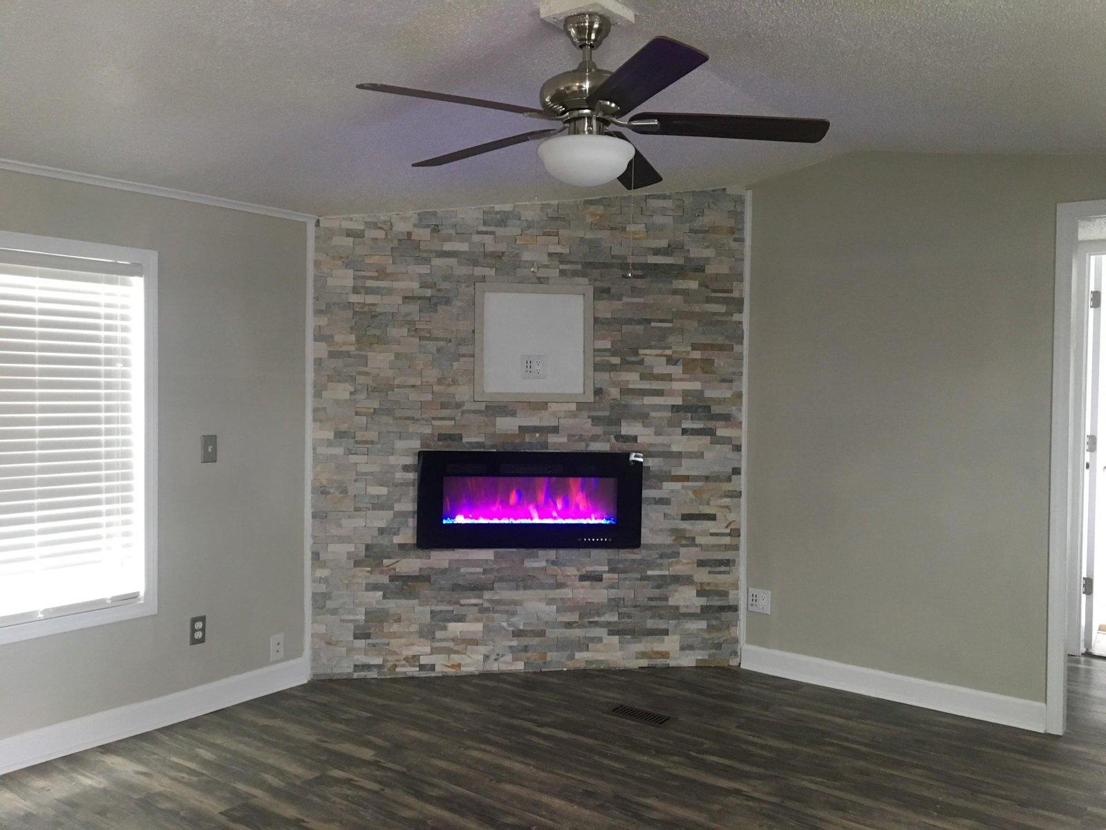 Living room with stone fireplace